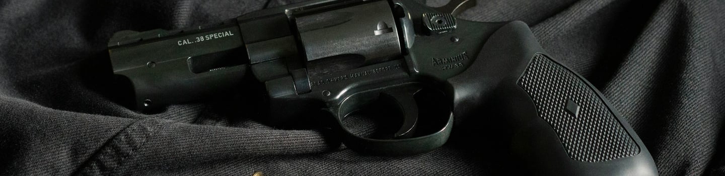 Background promoting KYGUNCO's firearm trade program: trade or sell your gun with ease