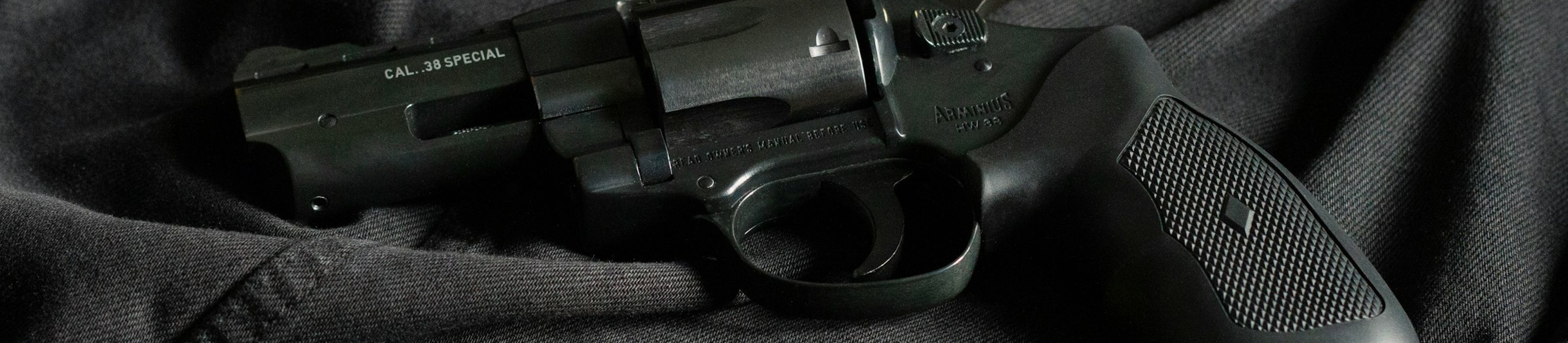Background promoting KYGUNCO’s firearm trade program: trade or sell your gun with ease